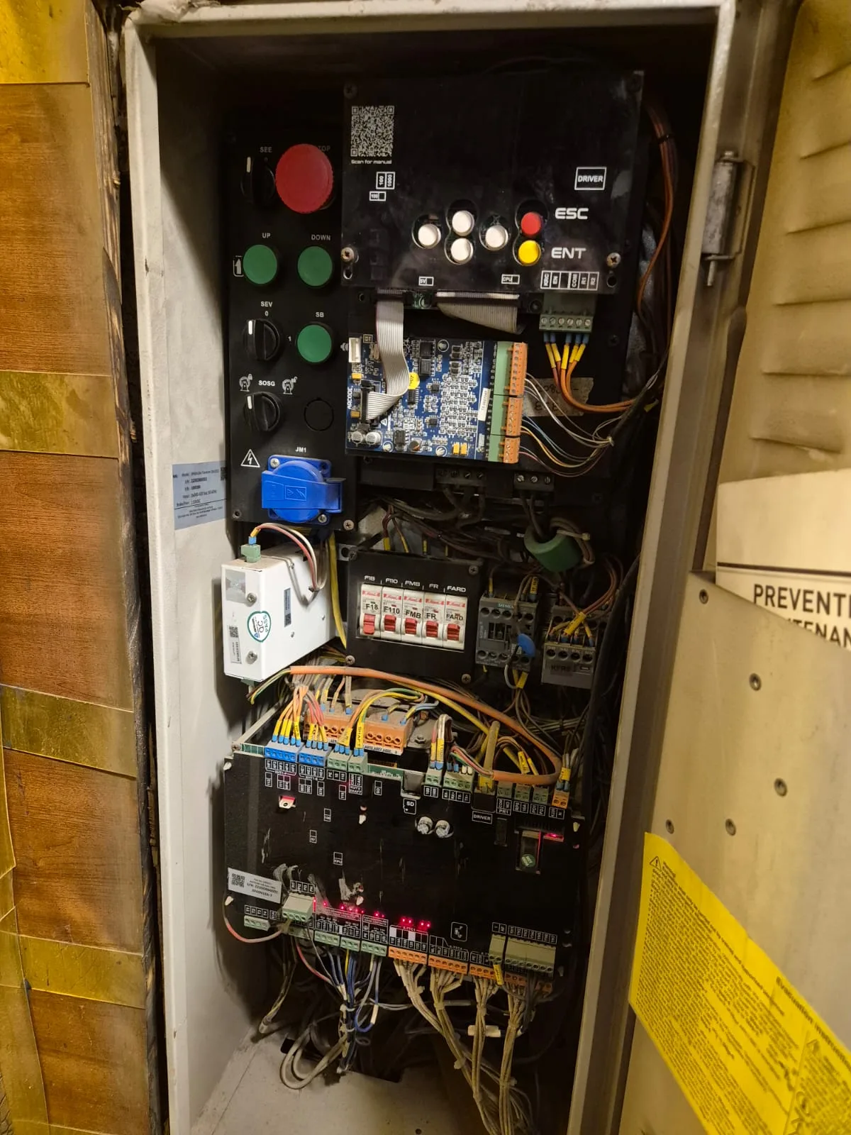 Elevator control panel with preventive-maintenance safety signage